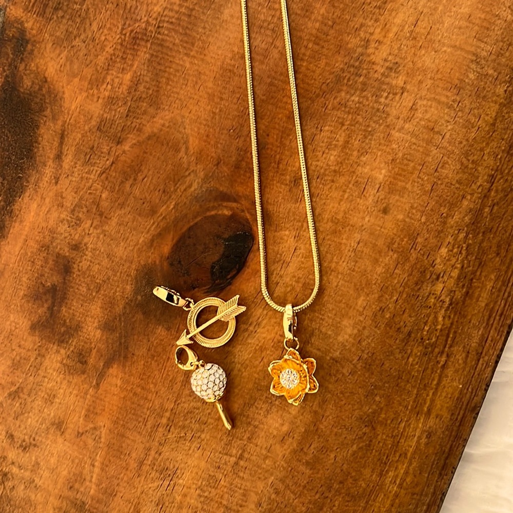 Spartina gold necklace with charms included.